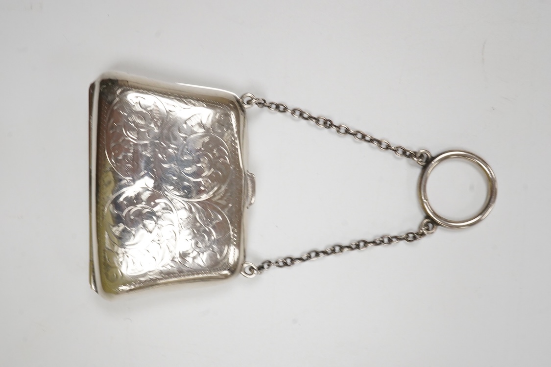 A George V engine turned silver card case, with suspension chain, Synyer & Beddoes, Chester, 1911, 97mm, together with a silver mounted purse, with suspension chain.